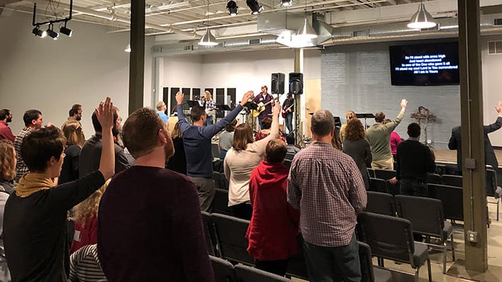 Congregation worshipping together in Minneapolis on Sunday morning